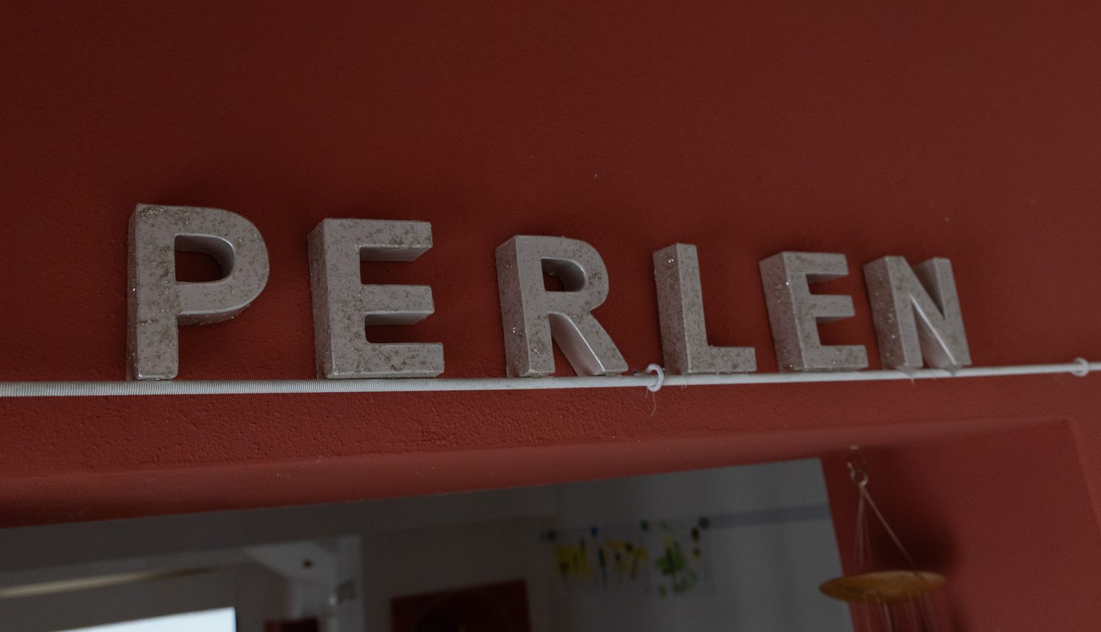 Türschild der Perlengruppe